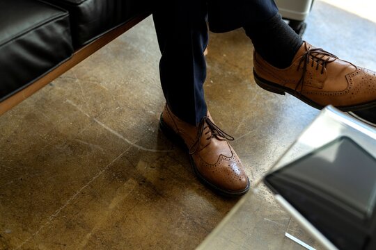 Elegant leather shoes on floor