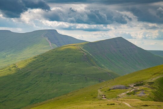 Brecon Beacons ( Bannau Bryncheiniog ) Pen y Fan mountain landscape with blue sky and clouds