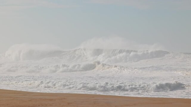 Big waves crushing in winter season in Nazare, Portugal