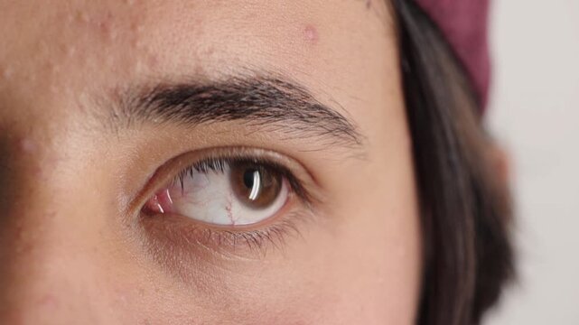 Blink, eye and thinking with closeup of boy for optometry appointment or vision correction. Exam, eyecare and sight of person at ophthalmology check for visual development, enhancement or improvement