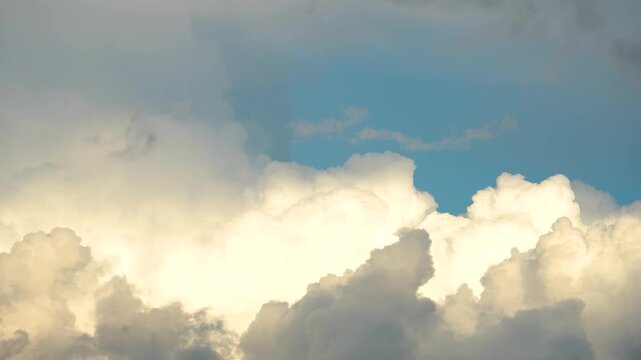 Timelapse cumulus clouds at sunset close-up