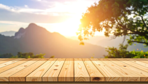 Empty wooden table in foreground with blurred mountain landscape and golden sunset sky, perfect for product display