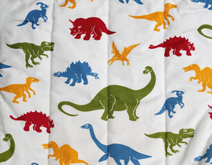 Colourful Dinosaur Pattern on Wrinkled Fabric Background © Goran