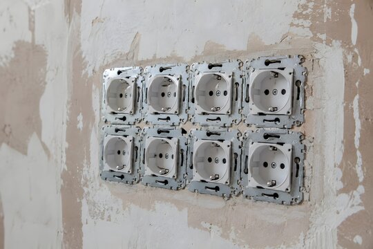 Multiple Electrical Power Outlets Installed on Unfinished Wall During Home Renovation