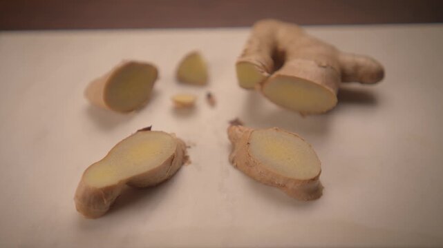fresh row organic ginger root on wooden background