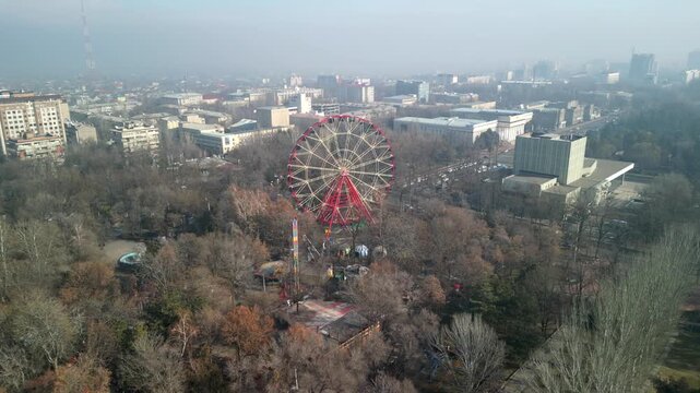 Bishkek Ferris Wheel at Panfilov Park, drone long rotation shot