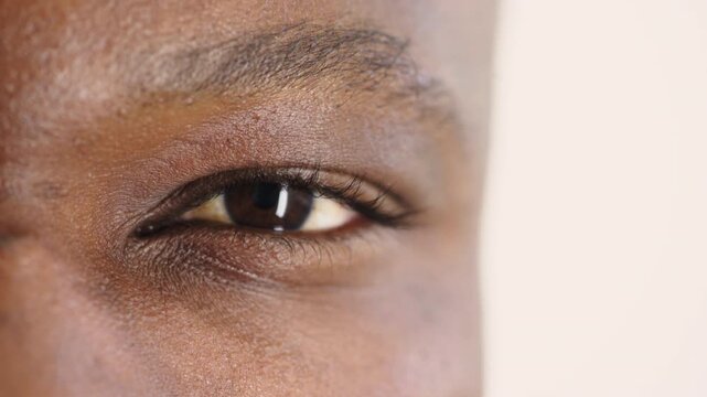 Person, vision and eye closeup with face for optometry test, optical health and ocular wellness. Eyesight, contact lenses and eyecare, visual assessment and space on white background in studio