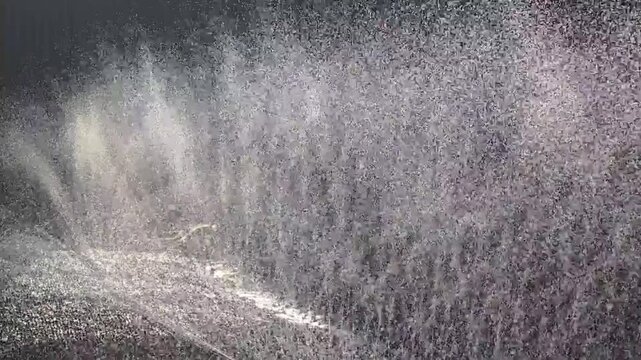 
Sprinkler slow motion back light water drops#002



