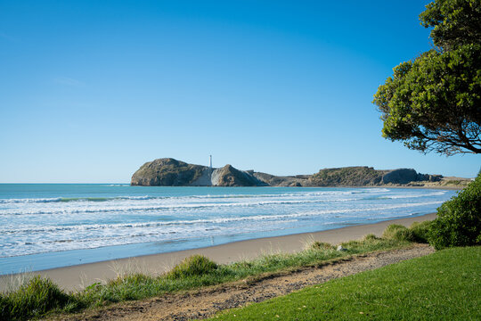 Beach coast and lighthouse on the rocks, Castlepoint, New Zealand