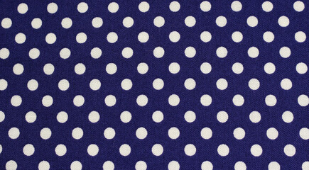 Close up of blue cloth with white polka dots. Texture of classic polka dot pattern cotton fabric background.  © Eriko Ochiai