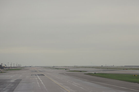 April 24 2026 Airport Runway And Taxiways Under Overcast Sky