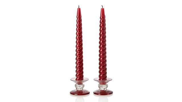 Two elegant red taper candles in crystal holders isolated on transparent background