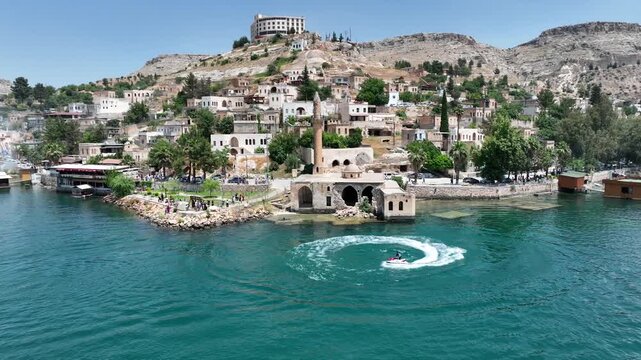 Drone Aerial View of Jet Ski Athlete Performing on the Halfeti River, May, 11, 2023, Sanliurfa, Halfeti, Turkiye