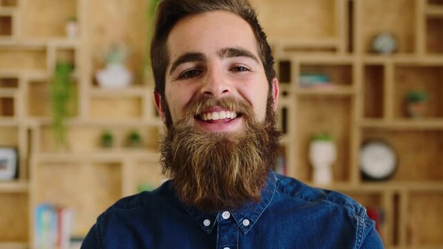 Creative, face or man in office with laugh, positive attitude or optimism in advertisement industry. Happy, portrait or branding clerk with good mood, joke reaction or confidence in marketing agency.