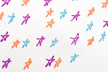 Fototapeta premium Hand drawn multi colored stars pattern on white paper close up. Vivid purple, orange, blue marker sketches of stars over whole surface. Creative design element with raw sketch texture on fiber.
