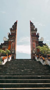 Traditional Balinese split gateway architecture, majestic Asian cultural monument 4K