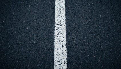 Fototapeta premium High contrast white lines textured on road surface for transportation safety copy space