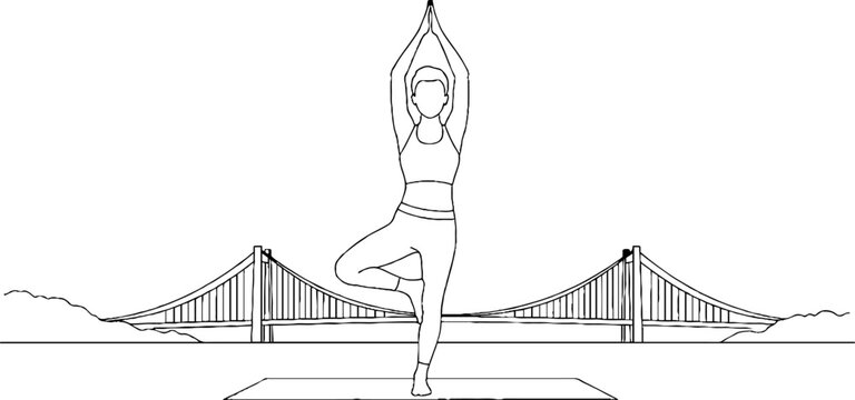 Woman practicing yoga tree pose with scenic bridge backdrop.