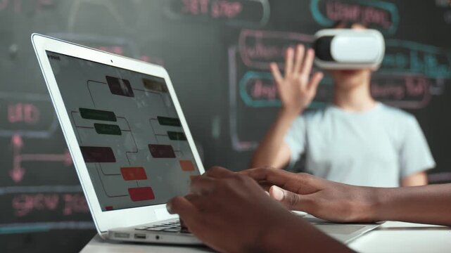 Closeup of african student hands coding or programming system at blackboard with web develop plan while young girl playing in metaworld at blackboard with engineering prompt. Innovation. Edification