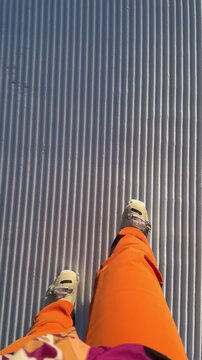 POV on freshly groomed corduroy snow in the Dolomiti Superski region, Italy. Perfect ski slope at the start of the day after snow grooming. Winter sports and alpine adventure