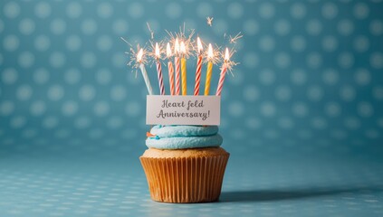 Obraz premium Sparkling birthday cupcake crowned by fourteen candles with a heartfelt anniversary card on a blue polka dot background