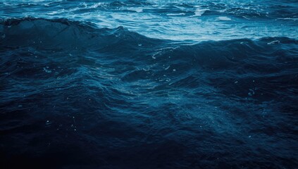 Fototapeta premium Zoomed in blue ocean wave texture background featuring minimal roughness