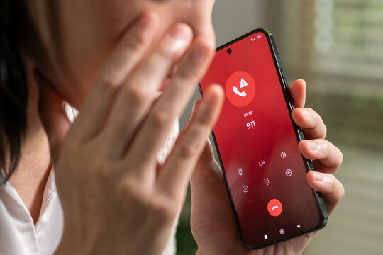 Woman calling emergency number 911 for crisis situation