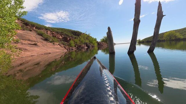 Immersive POV from a kayak - paddling on Horsetooth Reservoir in Fort Collins, Colorado, late spring scenery 