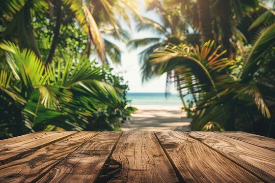 Empty wooden table in front of blurred tropical beach background, perfect for product placement