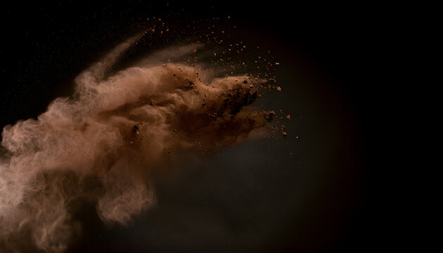 Brown cocoa powder exploding creating motion effect