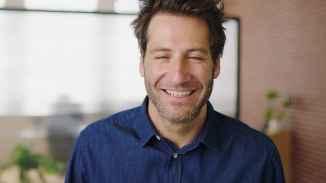 Laugh, business and face of man in office for marketing, brand consultant and confidence at agency. Startup, entrepreneur and portrait of person with pride for advertising, job and career growth