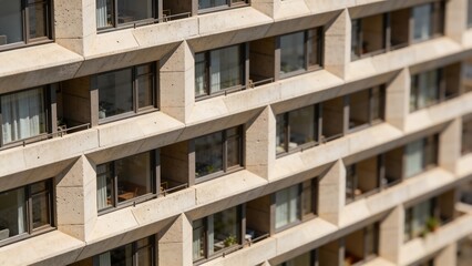 Fototapeta premium Generative AI depicts a modern concrete apartment building with multiple windows
