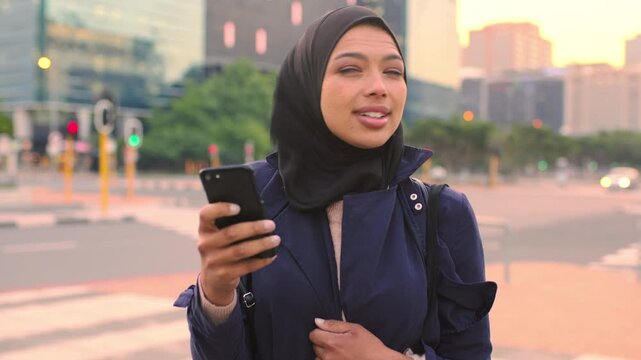 Search, reading or Muslim woman with phone in city, digital map or navigation for apartment location. Directions app, mobile or realtor with hijab for travel assistance, wind or smile in urban town
