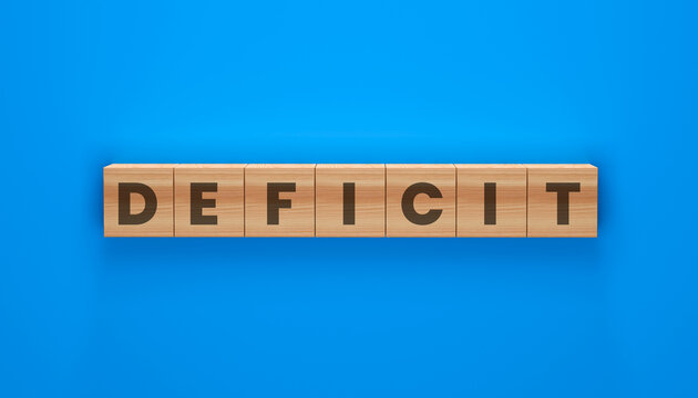 Deficit Wooden Blocks: A conceptual image illustrating the term 'Deficit' spelled out on wooden blocks arranged in a line against a vibrant blue background.