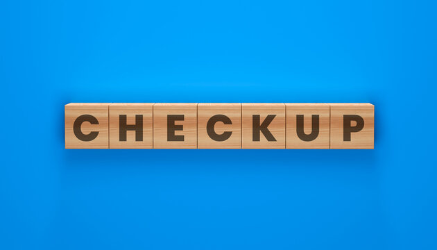 Checkup Word Blocks: Wooden blocks with the word Checkup are arranged in a line against a vibrant blue background, symbolizing a routine medical examination or a review.