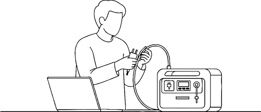 Person jump starting car battery with laptop nearby.