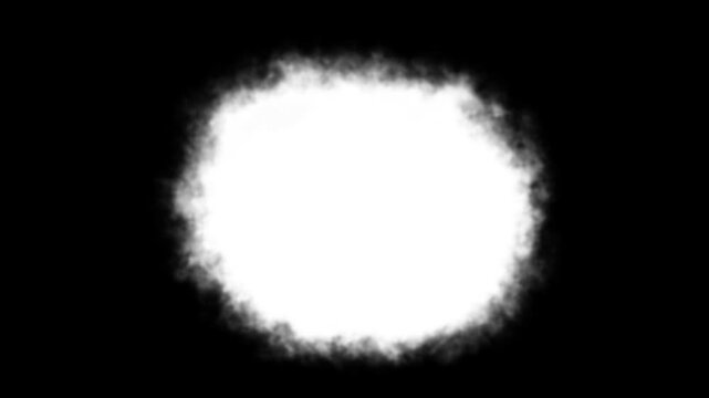 Circular white cloud like soft blurred smoke shape isolated on a solid black background texture
