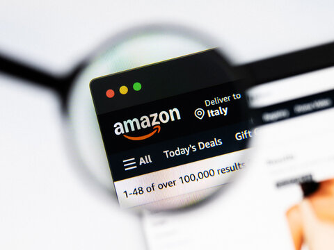 Milan, Italy 2026, 20 Apr Closeup of Amazon website on a laptop screen. Amazon logo under a magnifying glass.