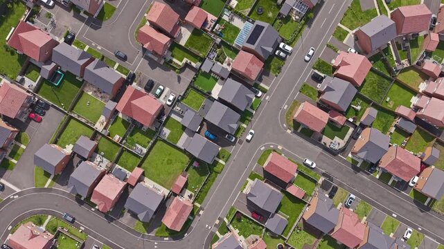 Aerial top down view of new build housing estate, gardens and street patterns on the Wirral, Merseyside, England