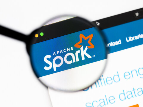 Milan, Italy 2026, 20 Apr Closeup of Apache Spark website on a laptop screen. Apache Spark logo under a magnifying glass.