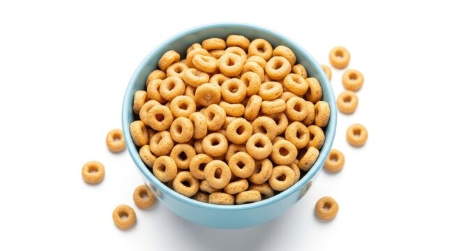A light blue bowl contains a pile of golden-brown O's cereal. Several individual cereal pieces are scattered around the bowl on a white surface.