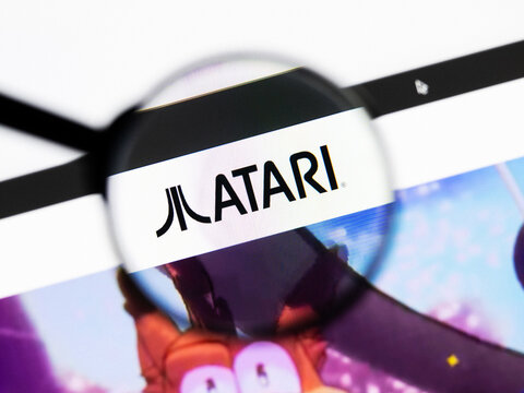 Milan, Italy 2026, 20 Apr Closeup of Atari website on a laptop screen. Atari logo under a magnifying glass.