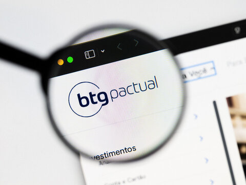 Milan, Italy 2026, 20 Apr Closeup of Banco Btg Pactual website on a laptop screen. Banco Btg Pactual logo under a magnifying glass.