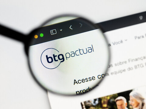 Milan, Italy 2026, 20 Apr Closeup of Banco Btg Pactual website on a laptop screen. Banco Btg Pactual logo under a magnifying glass.