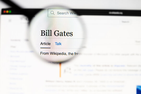 Milan, Italy 2026, 20 Apr Closeup of Bill Gates Wikipedia page on a laptop screen. Bill Gates name under a magnifying glass.
