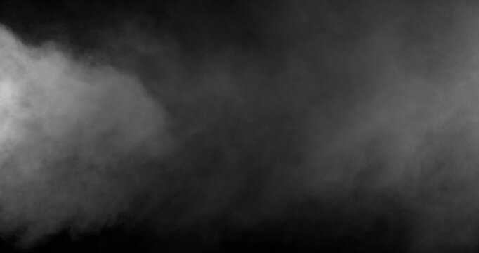 Detailed slow motion rising smoke isolated on black background. Cinematic fog overlay with soft swirling motion, ideal for VFX compositing, transitions and atmosphere.