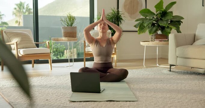 Woman, namaste and laptop with yoga in home for wellness, online course and breathing in lounge. Asian person, prayer hands and meditation with computer, virtual class and holistic fitness in house