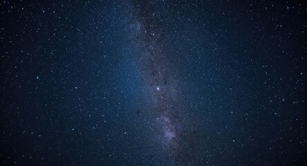 Fototapeta premium Stunning starry night sky featuring the Milky Way and distant galaxies