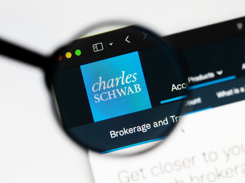 Milan, Italy 2026, 20 Apr Closeup of Charles Schwab website on a laptop screen. Charles Schwab logo under a magnifying glass.