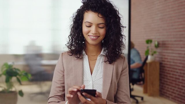Woman, phone and happy with typing at office, chat and check notification at startup. Person, smile and texting with mobile app, contact and scroll on social network with career at creative agency